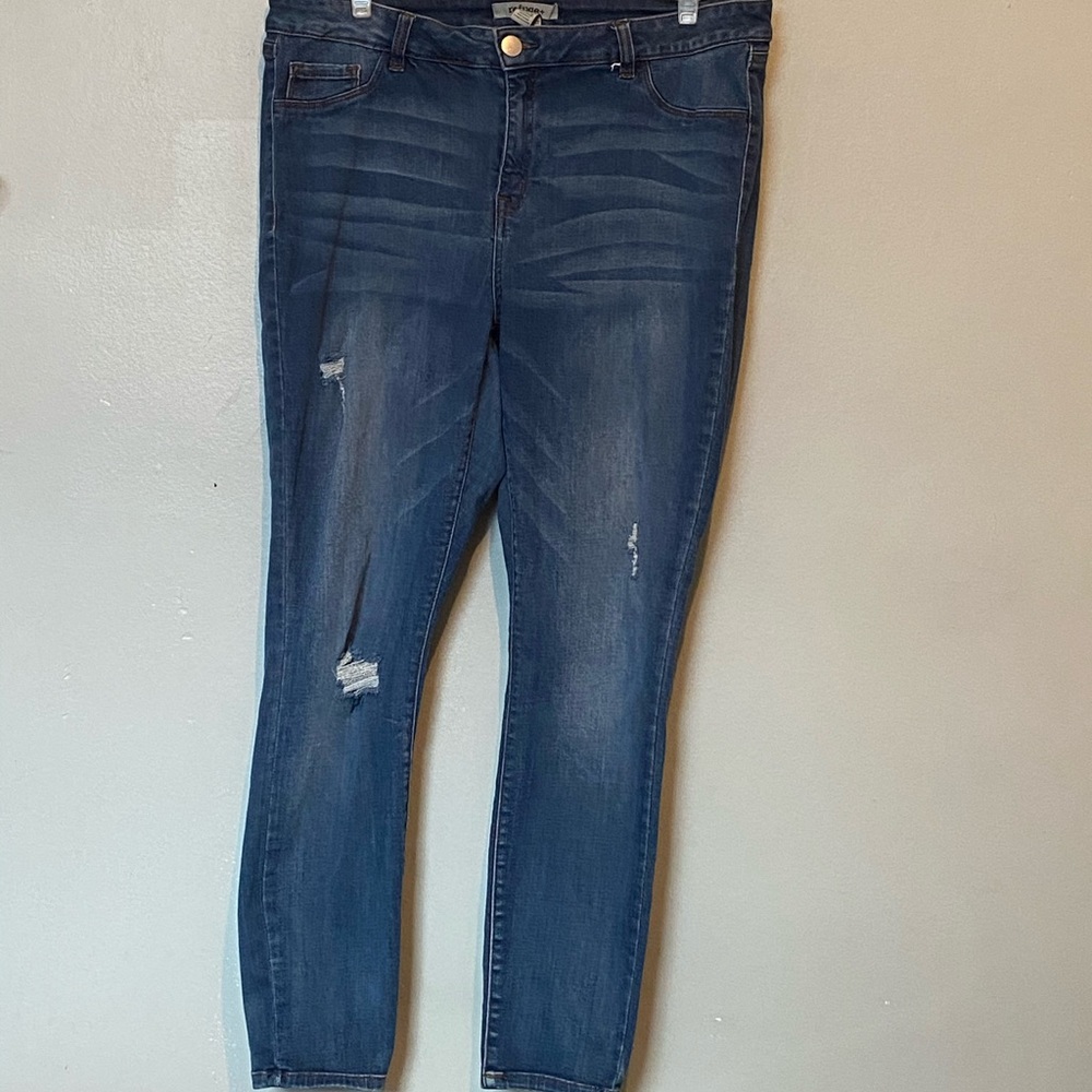 Distressed blue jeans